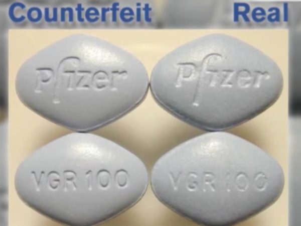 Counterfeit and real viagra pills