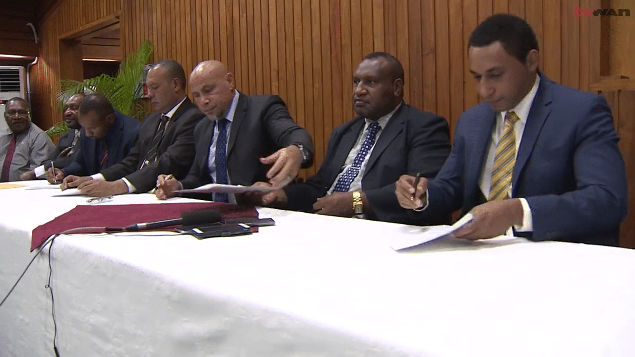 Ledger Atlas' Shane Ninai (far right) with members of PNG government