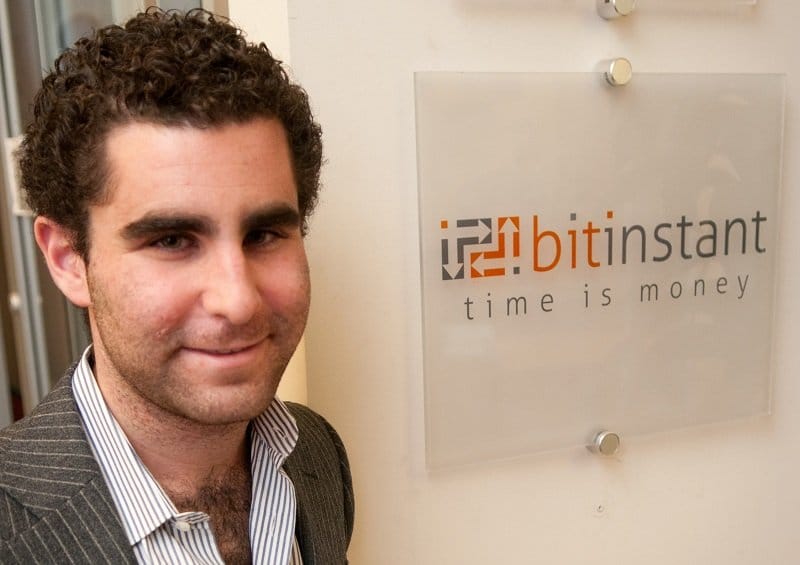 photo of Charlie Shrem next to the BitInstant logo